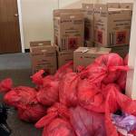 COVID-19 tests stored in trash bags. Photo from the Attorney Generals Office.