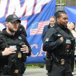 Two Secret Service agents patrol the crowd outside Green River College. Photo by Alex Bruell/Sound Publishing