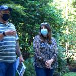 Matt Axe, the Wildfire and Forest Resiliency Coordinator with the King County Conservation District, speaks to homeowner Anita Kissee-Wilder about fire reduction strategies at her home in North Bend on Aug. 24, 2021. Photo by Conor Wilson/Valley Record