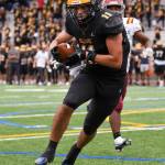 Bellevue High Schools junior and tight end, Hogan Hanson (#11), scores a touchdown. Courtesy of Stephanie Ault Justus.