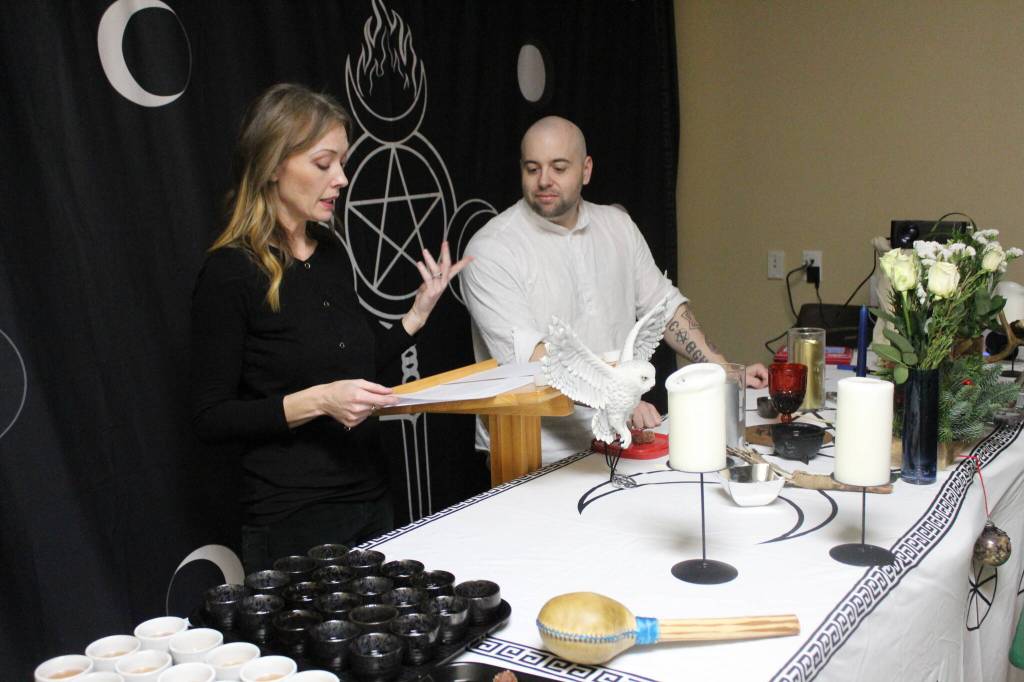 High Priestess Syleena and High Priest Kalu go through the ritual to make sure everything flows well together. This is the second sabbat their coven has utilized the space at 4 Sisters in Renton though they hope to have their own space in the future. "It's not much fun packing and unpacking everything," Syleena said with a laugh. Photo by Bailey Jo Josie/Sound Publishing.