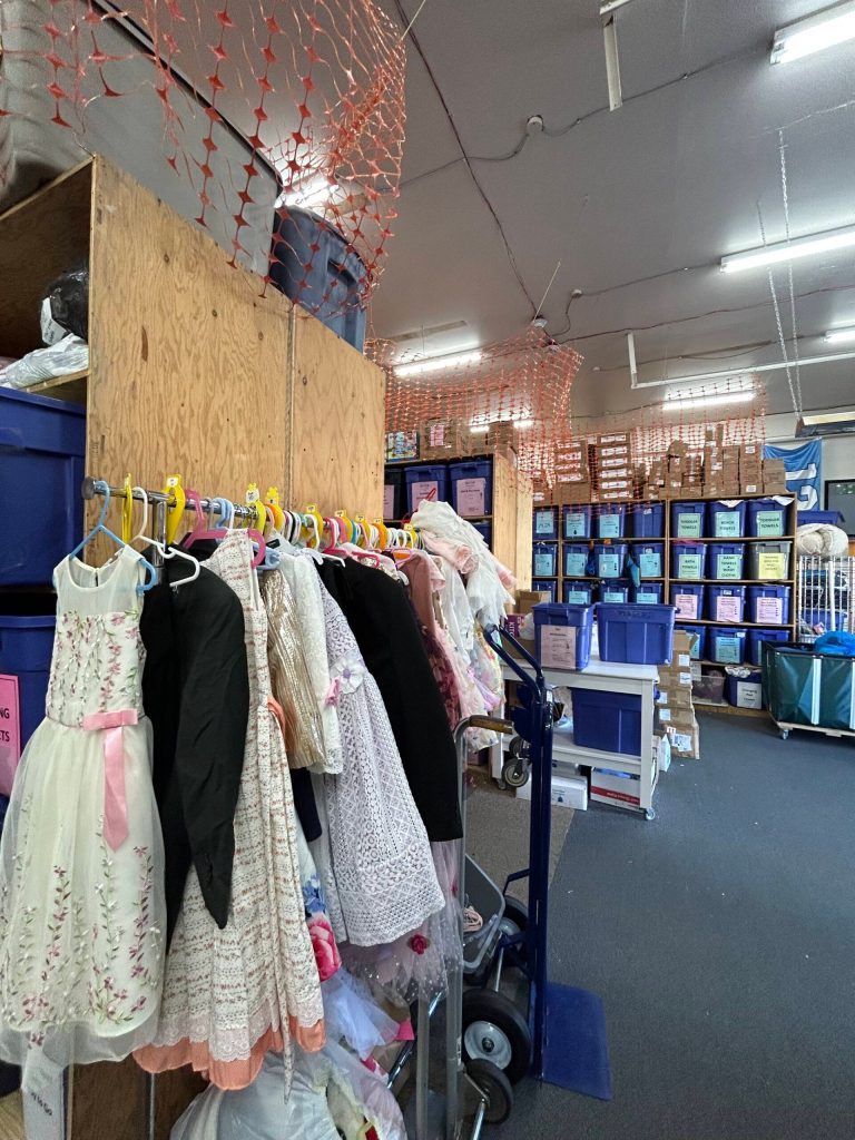 When partner agencies pick up the bundles, they can stop and shop at this rack with formal clothing if they know a child is going to an event. (Photo by Cameron Sires)