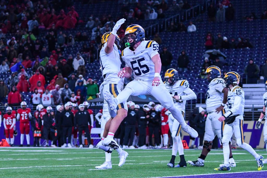 Bellevues Max Jones, left, and Ollie Sharp celebrate the Wolverines first touchdown. Photo courtesy of Stephanie Ault Justus