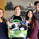 Andrea Robertson shows off one of last years prize baskets with First Fed team. Photo courtesy First Fed