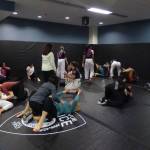 Instructors walk around to support and assist women. (Cameron Sires/ Sound Publishing)