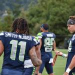 Seahawks wide receivers Jaxon Smith-Njigba and Jake Bobo chatting during the warm-up section of practice. Photos by Ben Ray / Sound Publishing