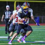 Bellevue Highs senior Bryce Smith rushes for a gain in the Wolverines 34-0 football victory over Mount Si High on Sept. 27. Photo courtesy of Stephanie Ault Justus