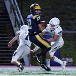 Bellevue senior Bryce Smith intercepts the ball away from Interlake sophomore Max Stephenson and junior Mykah Mondin. Photo courtesy of Stephanie Ault Justus