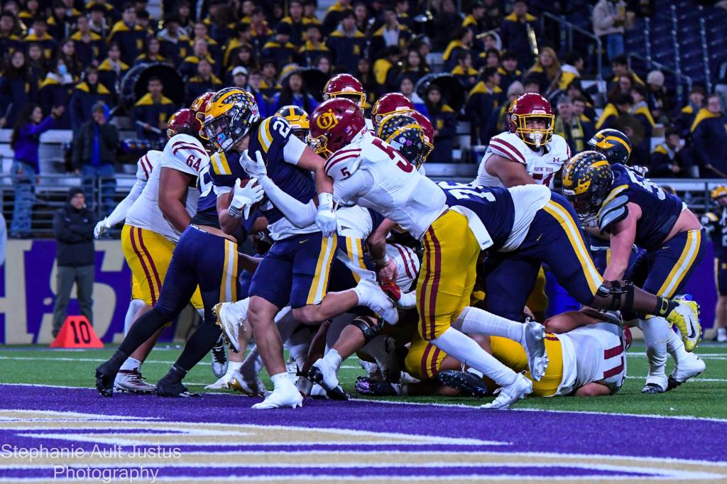 Bellevue junior Max Jones scores Bellevues second touchdown. Jones also ran the ball in for the two-point conversion. Photo courtesy of Stephanie Ault Justus