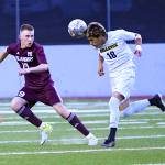 Bellevue High junior Fabian Navarro heads the ball away from Mercer Island High sophomore Noah Zenden. Photo courtesy of Stephanie Ault Justus
