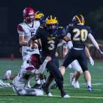 Bellevue High senior Reylen Witherspoon carries the ball while Bethel High freshman Dawsin Ridge tries to tackle him during the Wolverines 35-21 victory on Sept. 5. Photo courtesy of Stephanie Ault Justus