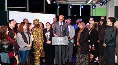 King County Executive Girmay Zahilay, surrounded by community members, announces an executive order to protect immigrants at a press conference Feb. 12, 2026. Photo courtesy of King County Office of the Executive