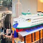 Courtesy photos
Left to right: Husseys Space Needle Lego model inside the Space Needle gift shop and his Issaquah Ferry Lego model.